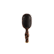 Hairbrush with tortoiseshell handle on a white background